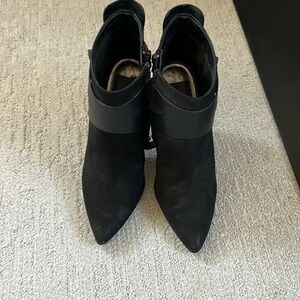 Suede and leather booties with pewter and chrome accents.